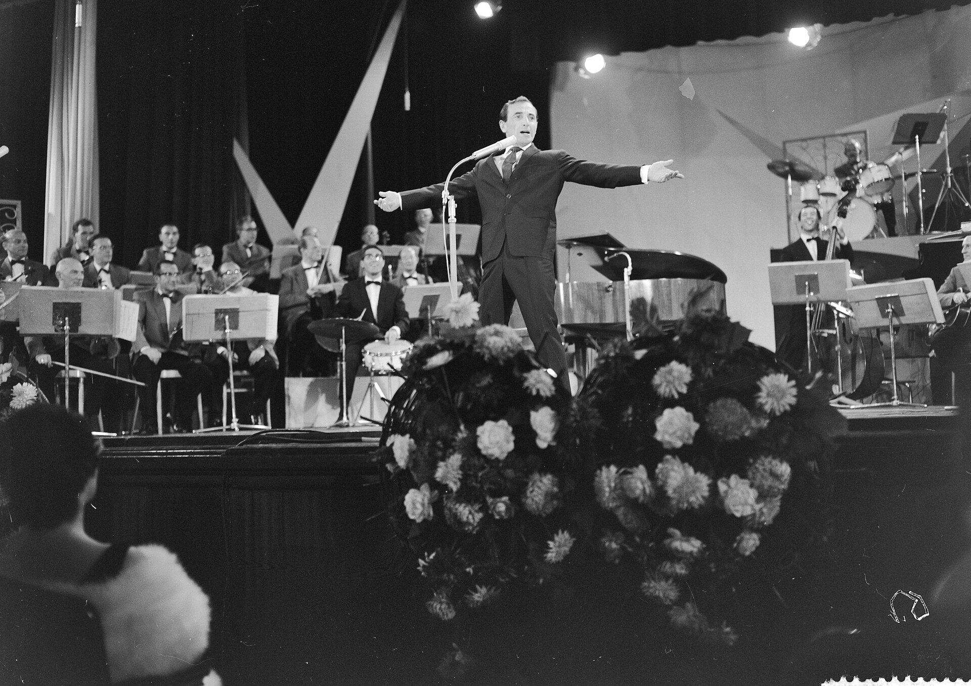 Aznavour on stage with a full orchestra, 1961